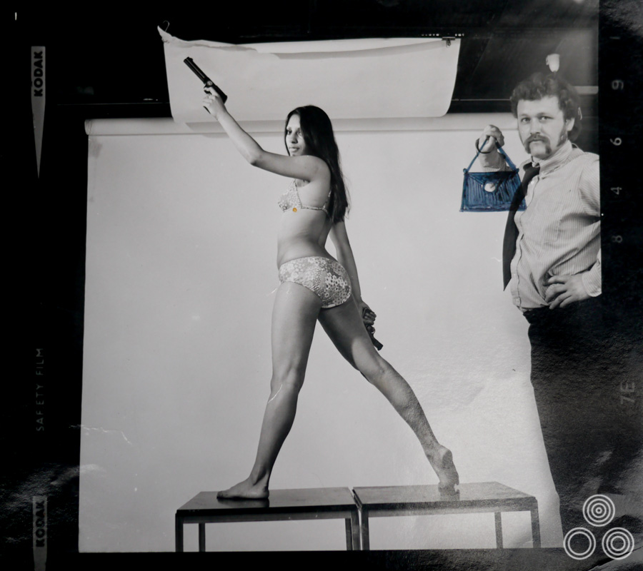 Vic Fair stands next to a model posing for a reference shot for a long-forgotten film, circa 1972. Someone, probably from the agency, later sketched a handbag into Vic's hand.