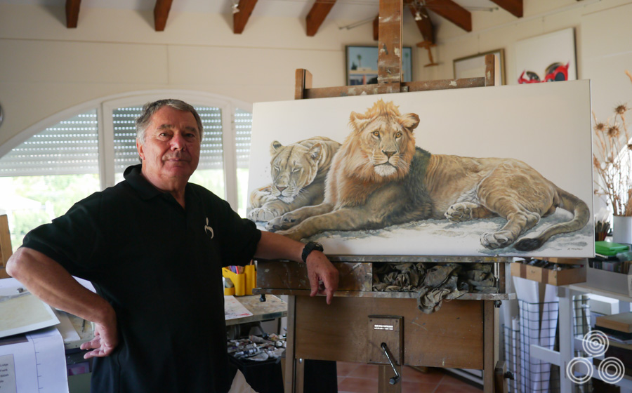 Renato Casaro stands next to his latest wildlife painting inside his home studio near Marbella, Spain. Photo taken in June 2013.